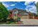 Charming two-story home featuring well-maintained landscaping, a brick facade, and a spacious three-car garage at 8286 W 108Th Pl, Broomfield, CO 80021