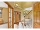 Open foyer with hardwood floors, staircase, and natural light through the windows creating an inviting atmosphere at 8286 W 108Th Pl, Broomfield, CO 80021