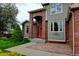 Stylish home showcasing brick columns, complemented by lush landscaping and a welcoming front entrance at 8286 W 108Th Pl, Broomfield, CO 80021