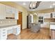 Spacious kitchen with a desk area, stainless steel appliances, and granite countertops at 8286 W 108Th Pl, Broomfield, CO 80021