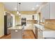 Modern kitchen with stainless steel appliances, granite countertops and a center island at 8286 W 108Th Pl, Broomfield, CO 80021