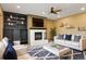 Comfortable living room featuring a fireplace, built-in bookshelves, and modern decor at 8286 W 108Th Pl, Broomfield, CO 80021