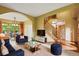 Inviting living room with a staircase, hardwood floors, archway and ample space for entertaining and relaxation at 8286 W 108Th Pl, Broomfield, CO 80021
