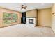 Bright living room featuring a fireplace, built-in shelving and large windows at 8286 W 108Th Pl, Broomfield, CO 80021