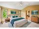 Stylish bedroom with an ensuite bathroom, a ceiling fan, and bright windows at 8286 W 108Th Pl, Broomfield, CO 80021
