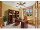 Charming home office with wood desk, built-in bookshelf, and natural light at 8286 W 108Th Pl, Broomfield, CO 80021