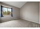 Bedroom with gray walls and carpet featuring a window and natural light at 9911 Perry Ct, Westminster, CO 80031