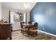Charming dining room featuring a chandelier, wood floors, and a large window at 9911 Perry Ct, Westminster, CO 80031