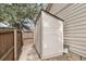 An outdoor storage shed next to the house is conveniently located next to the backyard fence and gate for easy backyard access at 9911 Perry Ct, Westminster, CO 80031