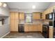 Updated kitchen with stainless steel appliances and wooden cabinets at 9911 Perry Ct, Westminster, CO 80031