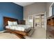 Spacious main bedroom features a unique bed frame design and access to an adjacent room at 9911 Perry Ct, Westminster, CO 80031