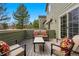 A cozy back deck provides an outdoor seating area with colorful throw pillows at 3548 W 126Th Pl, Broomfield, CO 80020