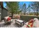 A comfortable back deck offers patio seating and trees create backyard privacy at 3548 W 126Th Pl, Broomfield, CO 80020