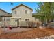 This backyard shows a patio and low-maintenance landscaping of gravel and trees at 3548 W 126Th Pl, Broomfield, CO 80020