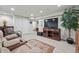 Spacious basement living area featuring comfortable seating, media center, and ample lighting at 3548 W 126Th Pl, Broomfield, CO 80020