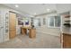 Basement office area with large desk, storage cabinets, and ample natural light from multiple windows at 3548 W 126Th Pl, Broomfield, CO 80020