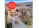 Sprawling property with mature trees and mountain views featuring a recent price reduction at 14290 W 54Th Ave, Arvada, CO 80002