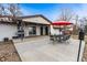 Inviting back patio with a barbecue and comfortable seating for outdoor enjoyment at 14290 W 54Th Ave, Arvada, CO 80002