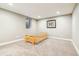 Clean, carpeted basement area with natural light and space for flexible use at 14290 W 54Th Ave, Arvada, CO 80002