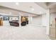 Spacious finished basement provides ample room for various activities, with neutral carpet and recessed lighting at 14290 W 54Th Ave, Arvada, CO 80002