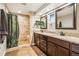 Bathroom boasts granite countertops and a walk-in tiled shower for added convenience at 14290 W 54Th Ave, Arvada, CO 80002