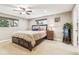 Comfortable bedroom with a ceiling fan and soft carpet flooring for a warm ambiance at 14290 W 54Th Ave, Arvada, CO 80002