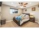 Inviting bedroom with a ceiling fan and carpet flooring featuring a cozy atmosphere at 14290 W 54Th Ave, Arvada, CO 80002