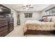 Neutral bedroom offers a relaxing space with a ceiling fan and natural lighting at 14290 W 54Th Ave, Arvada, CO 80002