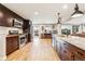 Modern kitchen features granite countertops, stainless steel appliances, and dark wood cabinetry at 14290 W 54Th Ave, Arvada, CO 80002