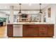 Modern kitchen with stainless steel appliances, granite countertops, and stylish pendant lighting at 14290 W 54Th Ave, Arvada, CO 80002