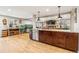 Spacious kitchen island with granite countertops and sink offers ample workspace at 14290 W 54Th Ave, Arvada, CO 80002