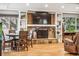 Cozy living room features a stone fireplace, built-in shelves, and natural light with hardwood floors at 14290 W 54Th Ave, Arvada, CO 80002