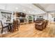 Spacious living room with hardwood flooring, recessed lighting, stone fireplace, and comfortable seating at 14290 W 54Th Ave, Arvada, CO 80002