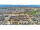 This aerial view shows the home in a neighborhood with nearby commercial areas, a river, and mountain views at 2019 S Fox St, Denver, CO 80223