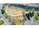 Scenic aerial view of a park featuring winding paths, a playground, and a river at 2019 S Fox St, Denver, CO 80223