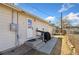 Side view of backyard featuring new steps up to back door, leading to a fenced in outdoor space at 2019 S Fox St, Denver, CO 80223