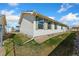 Backyard showcasing grass and vinyl siding with trim, offering a clean exterior look at 2019 S Fox St, Denver, CO 80223