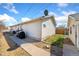 Back of house featuring a compact yard area and durable vinyl siding at 2019 S Fox St, Denver, CO 80223
