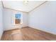 Bright bedroom featuring a window with natural light and a wood-look laminate flooring at 2019 S Fox St, Denver, CO 80223