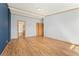 Bedroom featuring luxury vinyl plank flooring and convenient access to ensuite bathroom and closet at 2019 S Fox St, Denver, CO 80223