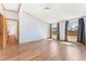 Bright bedroom with hardwood floors and natural light from multiple windows at 2019 S Fox St, Denver, CO 80223