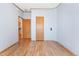 Bedroom with luxury vinyl plank flooring and convenient access to kitchen and closet at 2019 S Fox St, Denver, CO 80223