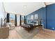 Comfortable bedroom with a statement wall, natural light, and chic decor creating a relaxing atmosphere at 2019 S Fox St, Denver, CO 80223