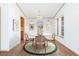 Cozy dining room with a round table, chandelier, and natural light at 2019 S Fox St, Denver, CO 80223