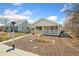 Charming home featuring a covered porch and a well-maintained front yard with unique landscaping details at 2019 S Fox St, Denver, CO 80223