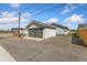 View of the home's detached garage and driveway at 2019 S Fox St, Denver, CO 80223