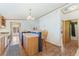 Open kitchen with wood cabinets, breakfast bar and modern finishes with luxury vinyl plank flooring at 2019 S Fox St, Denver, CO 80223