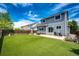 Backyard showing artificial turf and concrete patio with grill and outdoor seating area at 5794 S Yakima Way, Aurora, CO 80015