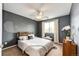 A calming bedroom features gray walls, carpet, and a window with natural light at 5794 S Yakima Way, Aurora, CO 80015