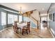 Charming dining room with a classic table setting, bright windows, and a staircase leading upstairs at 5794 S Yakima Way, Aurora, CO 80015